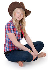 Image showing Beautiful girl in a cowboy hat