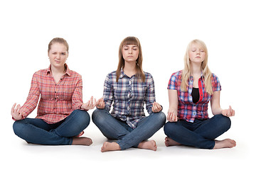 Image showing Three girls sitting in lotus posture