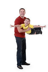 Image showing Dad keeps his son in his arms