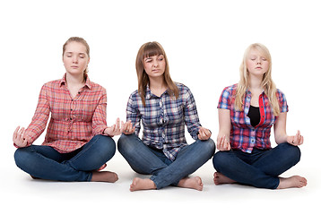 Image showing Three girls sitting in lotus posture