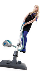 Image showing Girl with a vacuum cleaner