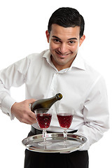 Image showing Smiling servant or waiter with wine 