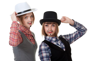 Image showing Two girls with painted mustaches