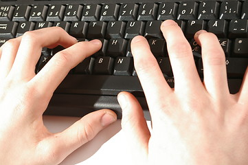 Image showing Hands writing on keyboard