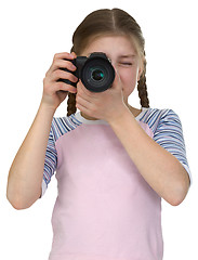 Image showing Little girl with camera isolated on white background