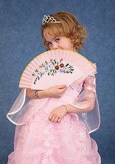 Image showing Beautiful little girl in pink dress with a fan