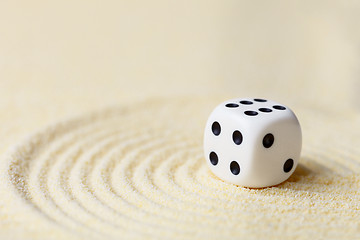 Image showing Art composition from playing dice on sand