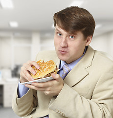 Image showing Young businessman is the dinner