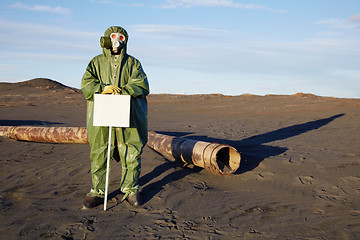 Image showing Scientist with warning tablet in infection zone