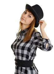 Image showing Beautiful young woman in black hat posing on white