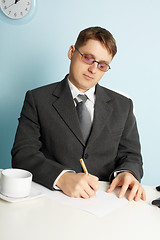 Image showing Businessman working in workplace in office