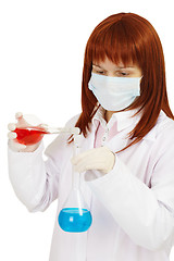Image showing Woman - scientist mixes poisonous solutions