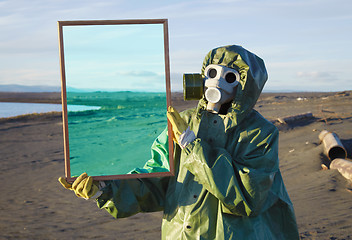 Image showing Ecologist shows desert through magic framework