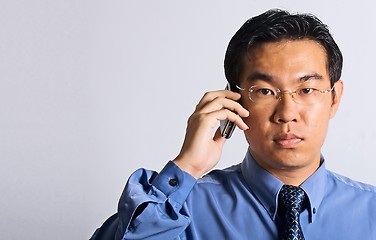 Image showing Asian Businessman with Phone