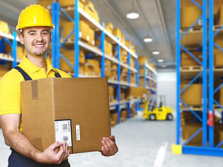 Image showing manual worker with parcel