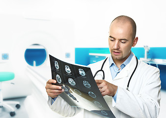 Image showing young doctor check tomography result