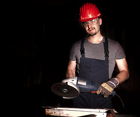 Image showing manual worker with grinder