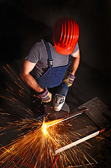 Image showing worker with grinder