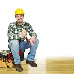Image showing handyman on wood floor