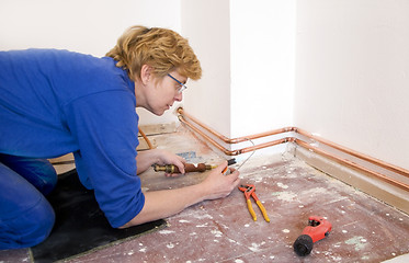 Image showing female plumber