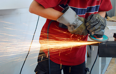 Image showing worker with grinder