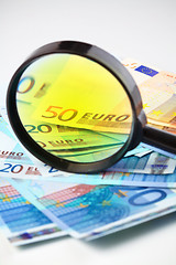 Image showing Euro currency under a magnifying glass