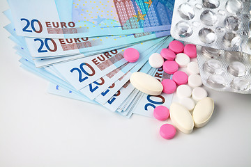 Image showing Few pills over Euro money