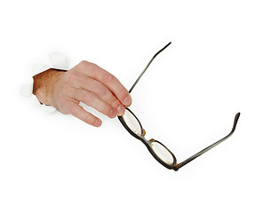 Image showing Hand holds glasse on white background