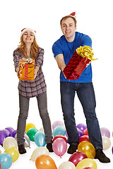 Image showing Man and woman give gifts isolated on white