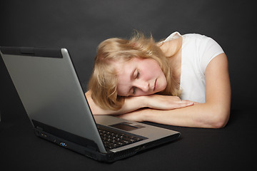 Image showing Woman tired from work in internet and went to sleep
