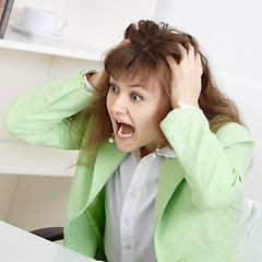 Image showing Frightened business woman loudly shouts