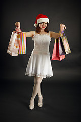 Image showing Woman rejoices to Christmas purchases