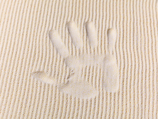 Image showing Trace from palm on sand surface