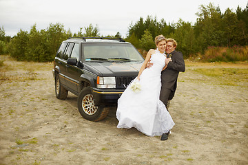 Image showing Newly married go to a honeymoon trip by car