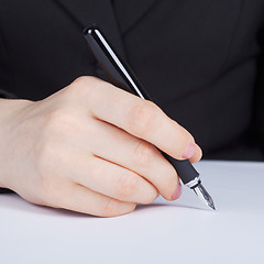 Image showing Female hand holding fountain pen