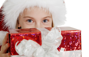 Image showing Teen girl in Christmas hat with a gift