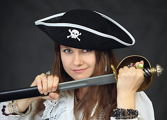 Image showing Portrait of woman - pirate getting sabre from a sheath