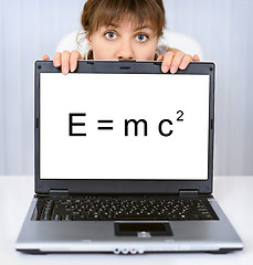 Image showing Woman shows computer screen with formula