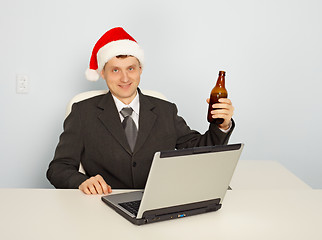 Image showing Office clerk celebrate Christmas at work
