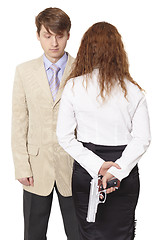 Image showing Young man and the woman armed with a pistol