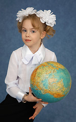 Image showing Schoolgirl with geographic globe