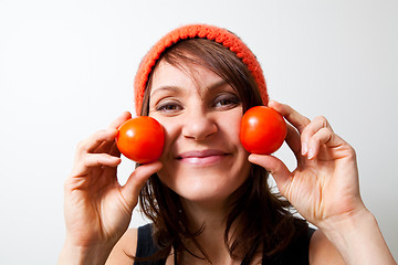 Image showing Young woman with tomato cheeks