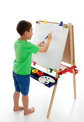 Image showing Little boy starting to paint a picture 