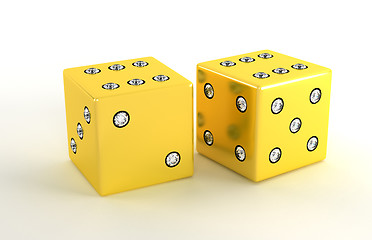 Image showing Two golden polished dies with diamonds 