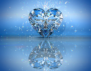 Image showing Heart shaped diamond over blue with reflection