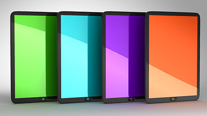 Image showing Group of four Tablets PCs with colored displays