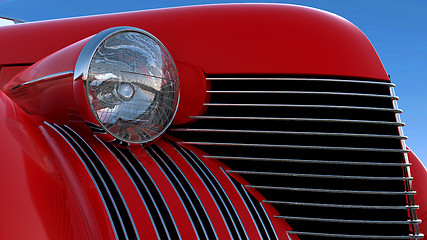 Image showing Headlight and engine jacket of red retro car