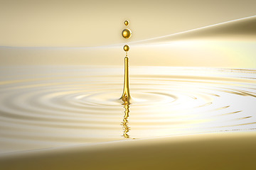 Image showing Splash of golden water droplet and waves