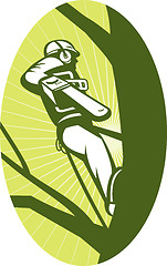 Image showing tree surgeon or arborist chainsaw cutting tree