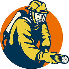 Image showing Firefighter or fireman aiming a fire hose